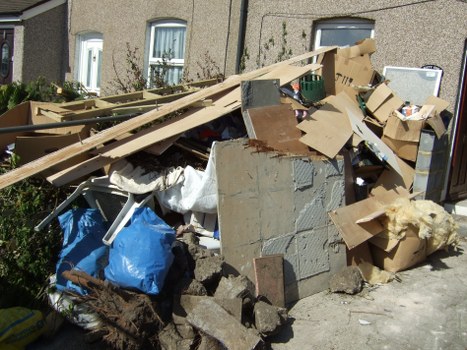 Photograph showing garden waste and removal items